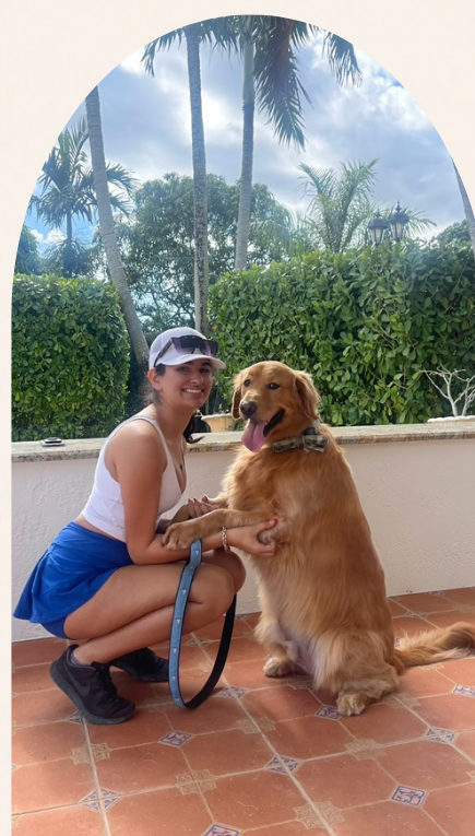 Isabella on a walk with a golden retriever